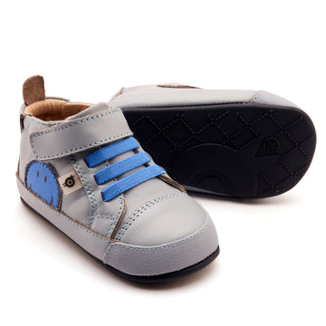 Gray and blue children's shoes on a white background