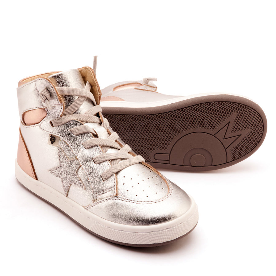 Pair of silver high-top sneakers with brown soles on a white background