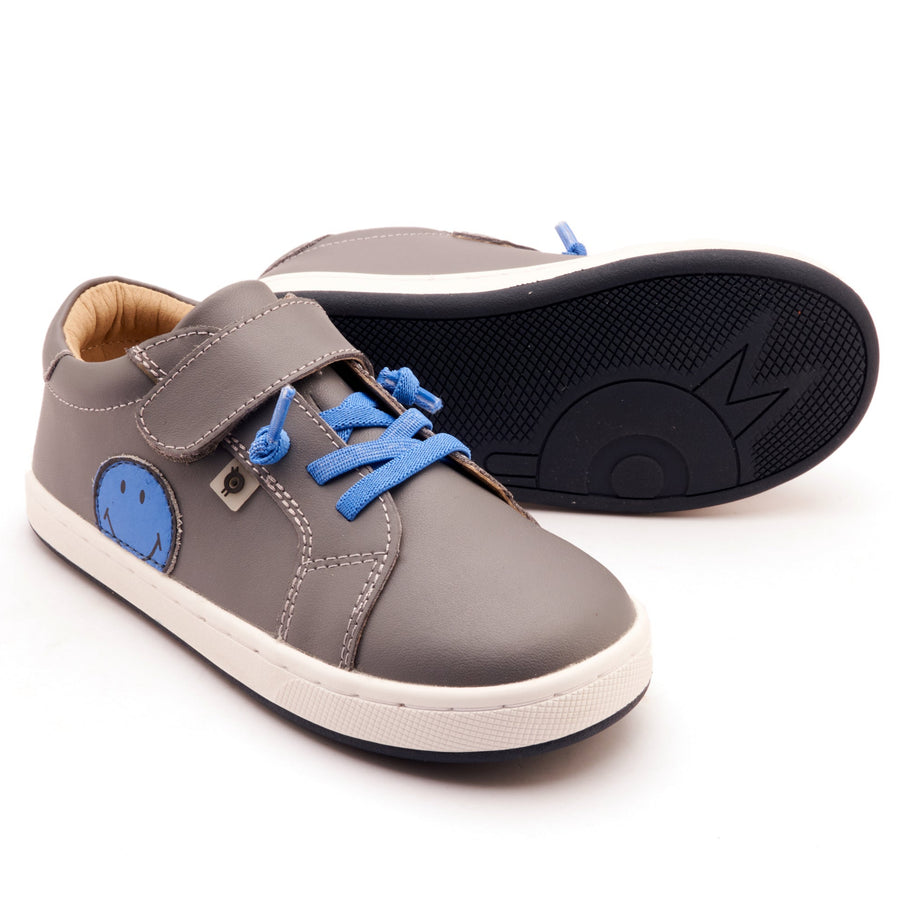 Gray children's shoes with blue accents on a white background