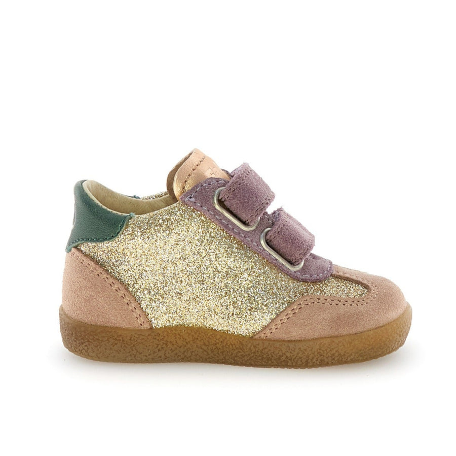 Child's shoe with gold and pink design on a white background