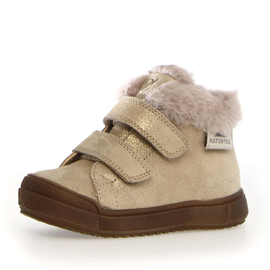 Beige children's shoe with fur trim on a white background